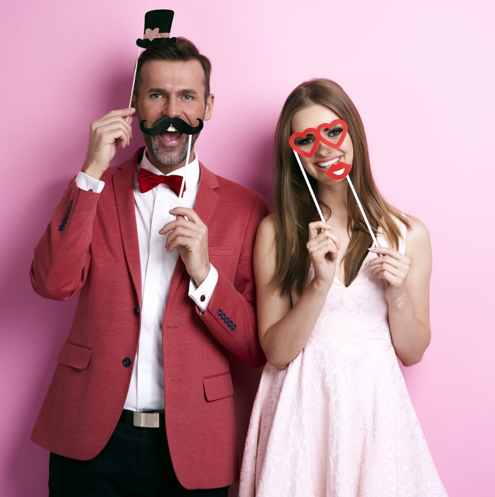 Couple with funny valentine's masks svg+xml;charset=utf